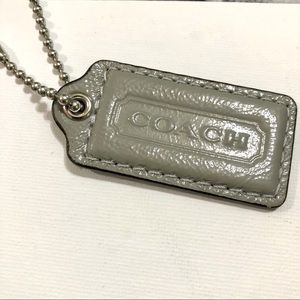 Gray patent COACH hangtag
